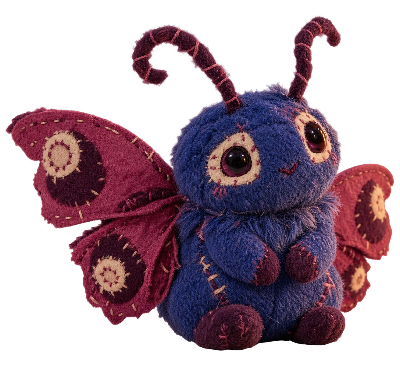 A handmade cobalt moth plush